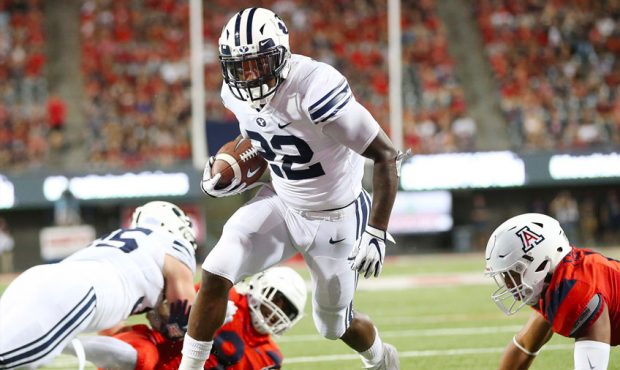 BYU running back Squally Canada runs the ball in for a touchdown against the Arizona Wildcat defens...