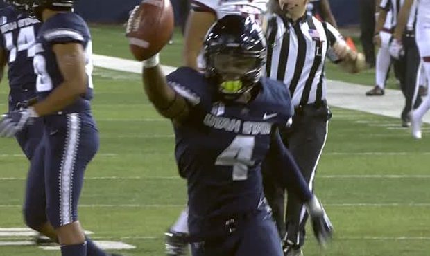 Utah State safety Aaron Wade celebrates a takeaway in the Aggies' win over New Mexico State....