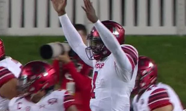 Utah quarterback Tyler Huntley celebrates a score in Utah's 17-6 win over NIU....
