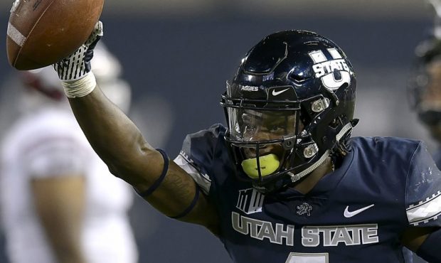 Utah State safety Aaron Wade (4) celebrates after intercepting a New Mexico State pass during an NC...