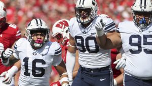 Brigham Young Cougars linebacker Sione Takitaki (16) gets fired up with the rest of the BYU defense after making a tackle during the Wisconsin versus BYU football game at Camp Randall Stadium in Madison, WI in Salt Lake City on Saturday, Sept. 15, 2018. Steve Griffin, Deseret News