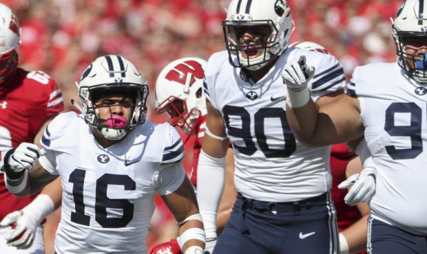 Brigham Young Cougars linebacker Sione Takitaki (16) gets fired up with the rest of the BYU defense...