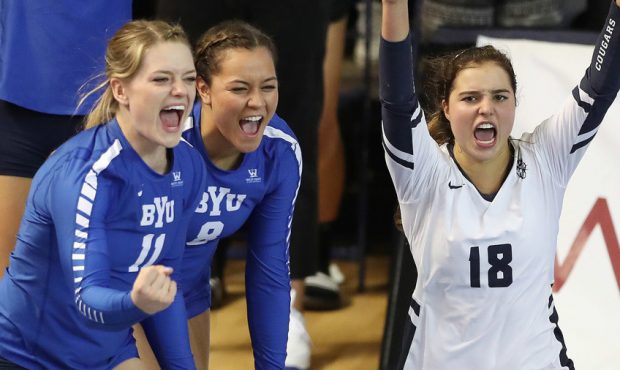 BYU's Mary Lake (18) and her teammates celebrate a point against Utah in Provo on Thursday, Sept. 1...