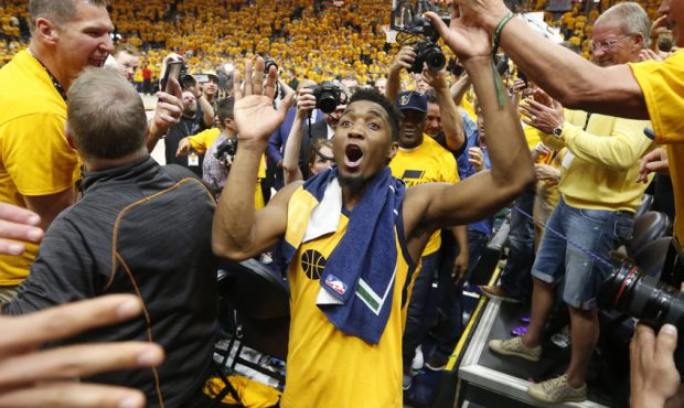 Utah Jazz guard Donovan Mitchell (45) celebrates with fans as he leaves the court following the Jaz...