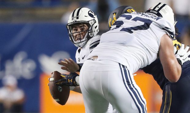 Brigham Young Cougars quarterback Tanner Mangum (12) is sacked by the California Golden Bears in Pr...