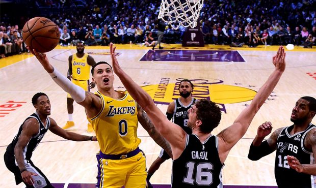 LOS ANGELES, CA - OCTOBER 22: Kyle Kuzma #0 of the Los Angeles Lakers scores on a layup past Pau Ga...