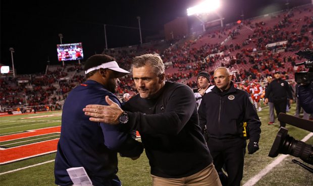 Arizona Wildcats head coach Kevin Sumlin and Utah Utes head coach Kyle Whittingham shake hands afte...