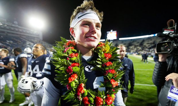 Brigham Young Cougars quarterback Zach Wilson (11) celebrates the win with teammates and fans as BY...