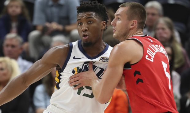 Toronto Raptors forward Kyle Collinsworth guards Utah Jazz guard Donovan Mitchell in preseason acti...