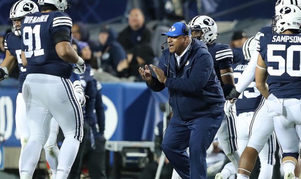 Brigham Young Cougars head coach Kalani Sitake cheers for his players after a fourth down stand as ...