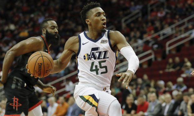 HOUSTON, TX - OCTOBER 24: Donovan Mitchell #45 of the Utah Jazz drives to the basket defended by Mi...