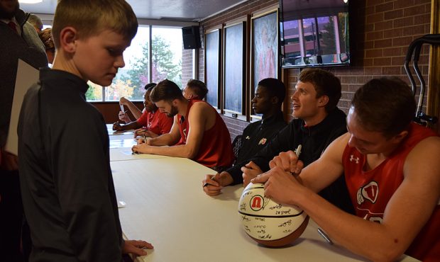 Members of the University of Utah men's basketball team sign autographs at Night with the Utes. (Au...