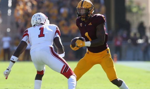 : Wide receiver N'Keal Harry #1 of the Arizona State Sun Devils runs with the football after a rece...
