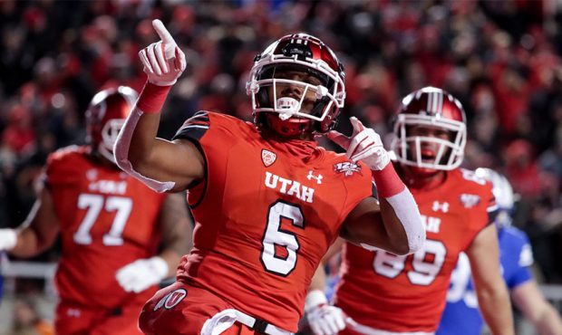 Utah Utes running back Armand Shyne (6) celebrates after running the ball for a touchdown, bringing...