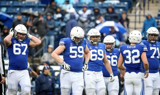 BYU's offensive line competes in the annual Blue-White Game at LaVell Edwards Stadium in Provo on S...