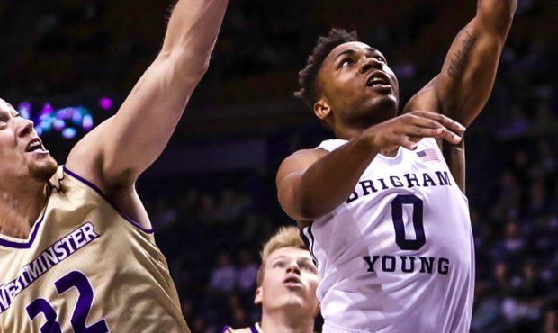 BYU's Jahshire Hardnett drives towards the basket for a layup in their win over Westminster. The Co...