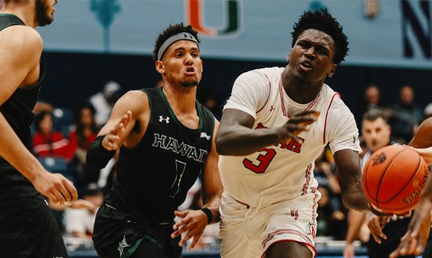 Utah forward Donnie Tillman (3) faces Hawaii defenders in the quarterfinals of the Wooden Legacy To...