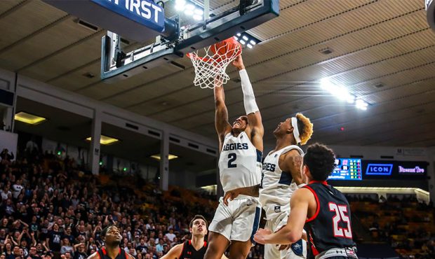 Utah State's Dwayne Brown Jr. dunks the basketball against Hartford on November 9, 2018 at the Spec...