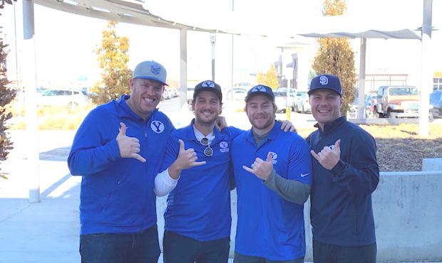 Former Utah specialists Tom Hackett and Andy Phillips (middle) pose with former BYU offensive linem...