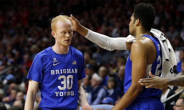 Brigham Young Cougars guard TJ Haws is greeted by Brigham Young Cougars forward Yoeli Childs as he ...