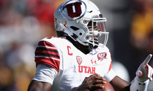 Quarterback Tyler Huntley #1 of the Utah Utes looks to pass during the first half of the college fo...