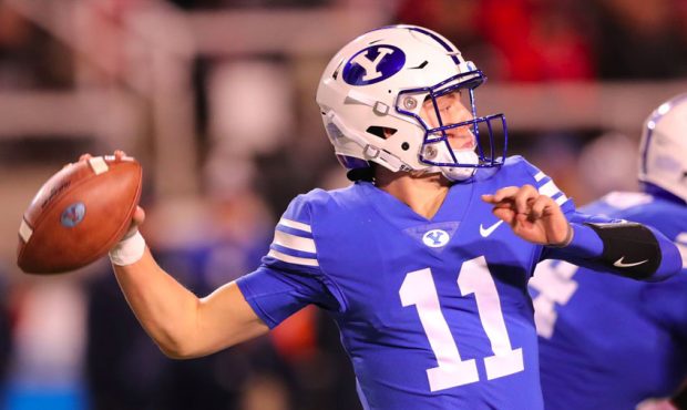 Brigham Young Cougars quarterback Zach Wilson (11) makes a pass as BYU and Utah play at Rice-Eccles...