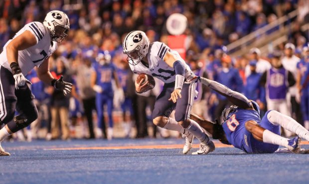 BOISE, ID - NOVEMBER 3: Quarterback Zach Wilson #11 of the BYU Cougars pulls away from the tackle o...