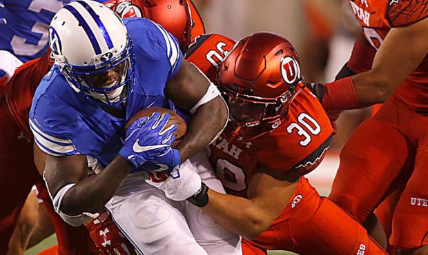 SALT LAKE CITY, UT - SEPTEMBER 10: Jamaal Williams #21 of the Brigham Young Cougars is tackled by C...