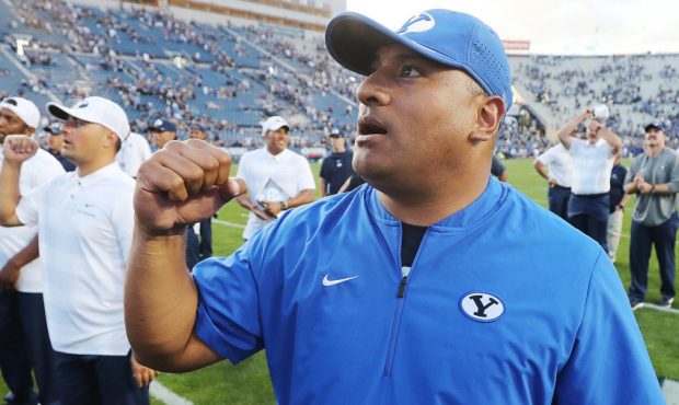 Brigham Young Cougars head coach Kalani Sitaki sings the fight song after beating the McNeese State...