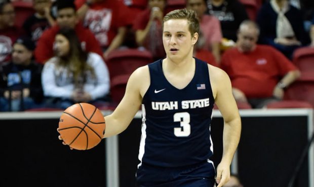 LAS VEGAS, NV - MARCH 09: Sam Merrill #3 of the Utah State Aggies brings the ball up court against ...