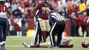 LANDOVER, MD - NOVEMBER 18: Alex Smith #11 of the Washington Redskins lays on the field after being sacked and injured by Kareem Jackson #25 of the Houston Texans in the third quarter of the game at FedExField on November 18, 2018 in Landover, Maryland. (Photo by Joe Robbins/Getty Images)