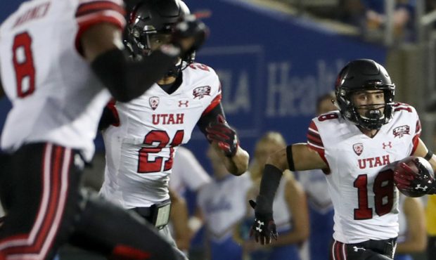 Utah Utes wide receiver Britain Covey (18) returns a punt up the sidelines during the University of...
