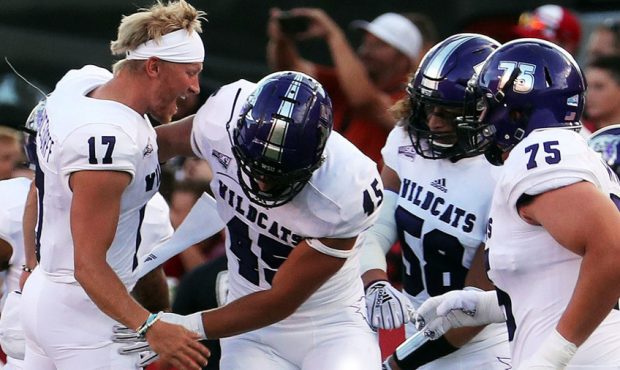 The Weber State Wildcats celebrate a touchdown during NCAA football against the Utah Utes in Salt L...
