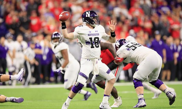 Clayton Thorson #18 of the Northwestern Wildcats throws a pass against the Ohio State Buckeyes duri...