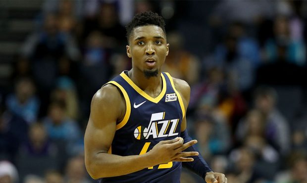 Donovan Mitchell #45 of the Utah Jazz reacts after a play against the Charlotte Hornets during thei...