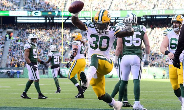 Jamaal Williams #30 of the Green Bay Packers celebrates after scoring a touchdown against the New Y...