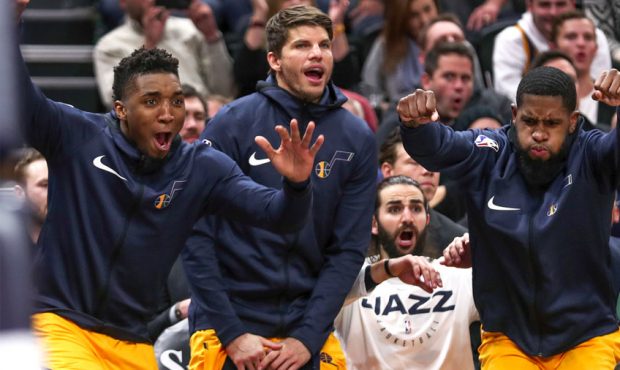 Utah's Donovan Mitchell, Kyle Korver, Ricky Rubio and Royce O'Neale explode from the bench as the J...
