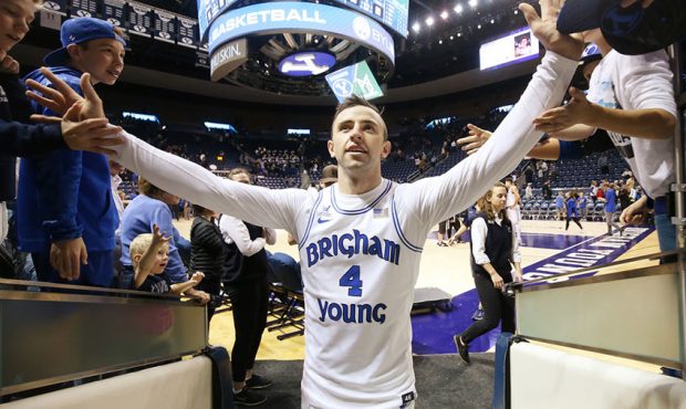 Brigham Young Cougars guard Nick Emery (4) high-fives fans after the USU game in Prov...