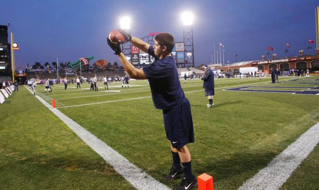 Brigham Young Cougars defensive lineman Michael Doman (93) catches a pass during warmups prior to t...