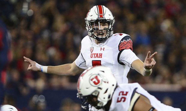 Quarterback Travis Wilson #7 of the Utah Utes calls a play prior to snapping the football against t...