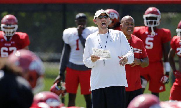 Offensive coordinator Troy Taylor yells instructions during University of Utah football practice in...