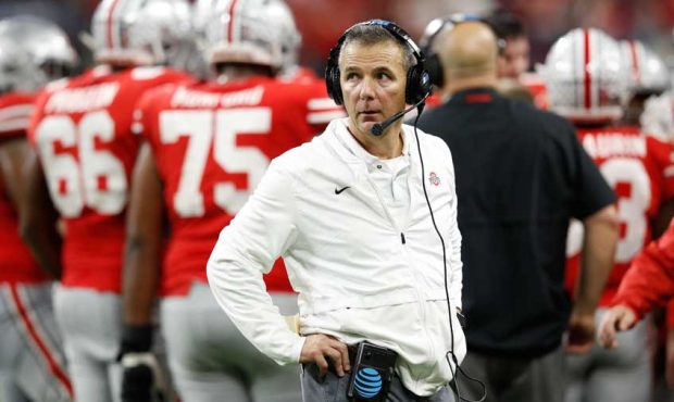 Head coach Urban Meyer of the Ohio State Buckeyes looks up at the score board against the Northwest...