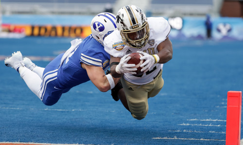 Western Michigan Broncos running back Davon Tucker (22) dives in for a touchdown ahead of Brigham Y...