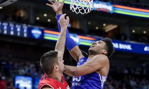 Brigham Young Cougars forward Yoeli Childs (23) goes to the hoop against Utah Utes forward Novak To...