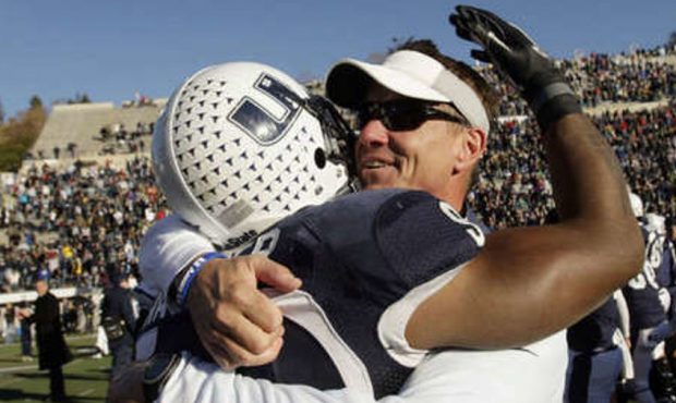 Utah State Aggies head coach Gary Andersen hugs Utah State Aggies linebacker Bobby Wagner (9) in Lo...