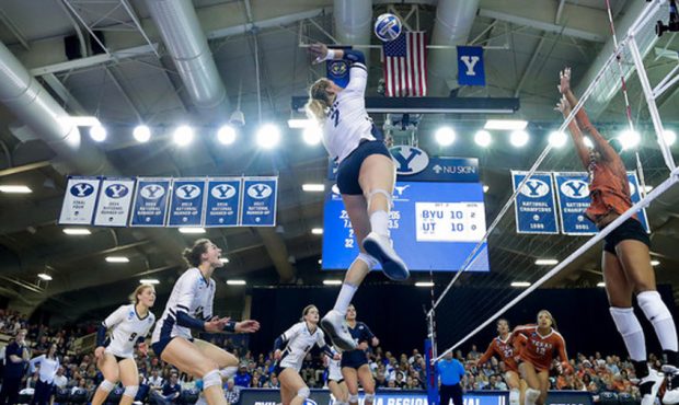 BYU's Heather Gneiting spikes the ball against Texas during an NCAA women's volleyball match, Satur...