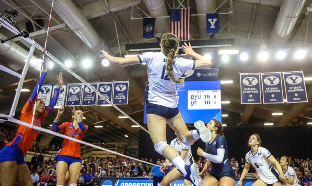 BYU's Roni Jones-Perry (12) hits the ball during the NCAA volleyball regional semifinal against Flo...