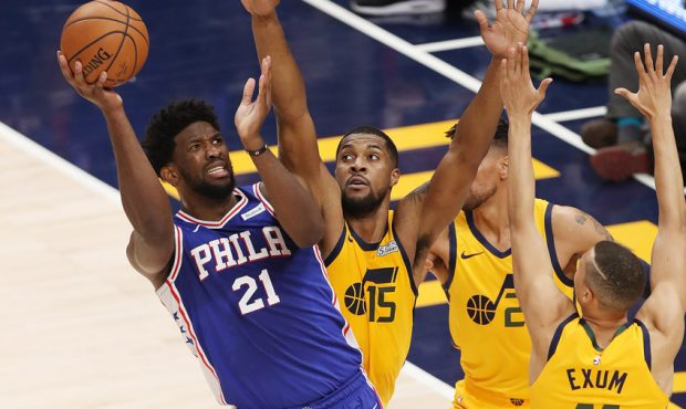 Philadelphia 76ers center Joel Embiid (21) is defended by several Jazz players in Salt Lake City on...