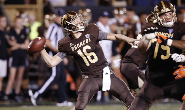 Jon Wassink #16 of the Western Michigan Broncos throws a pass against the Syracuse Orange in the th...