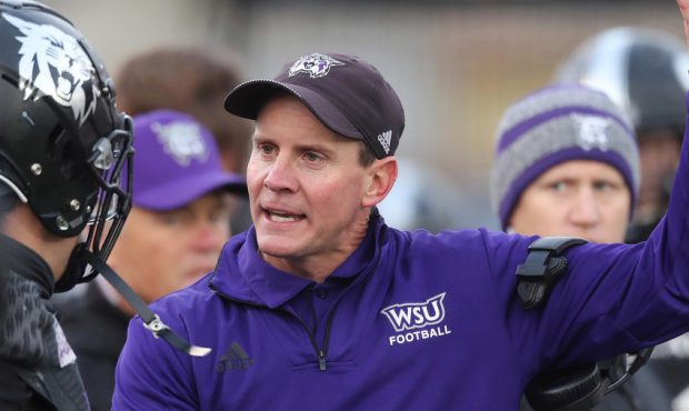 Weber State Wildcats head coach Jay Hill talks with a player in Ogden on Saturday, Dec. 1, 2018. (J...